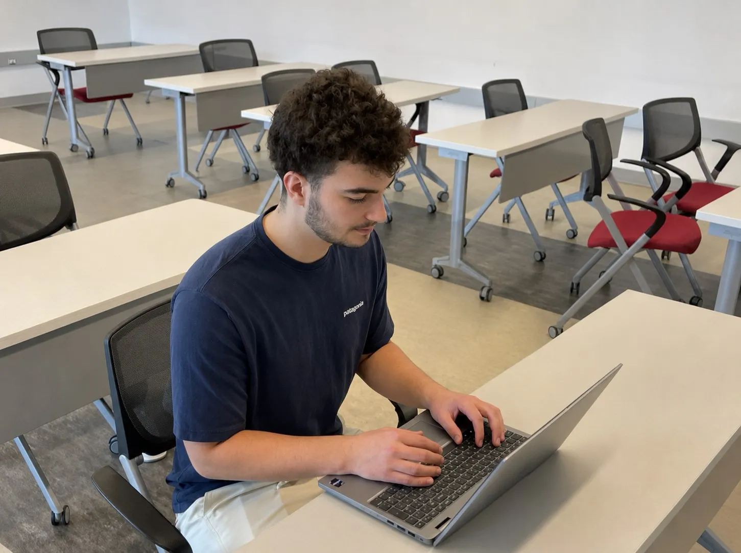 Evan Kuczer working on a website from his laptop